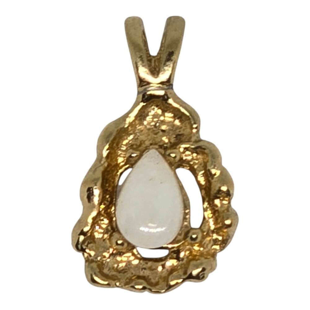 Gold Tone Pendant With White Teardrop Stone Textured Design Approx. 1 Inch Long
